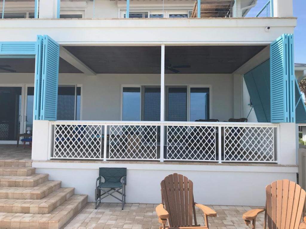 Aqua blue colonial shutters open