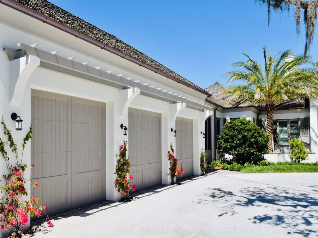 custom brown garage doors with pink flowers on the sides