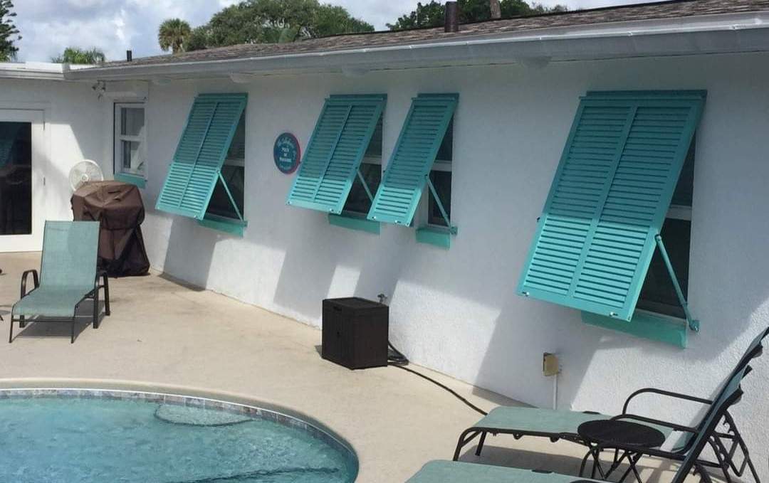 Teal Bahama Shutters on Pool Deck