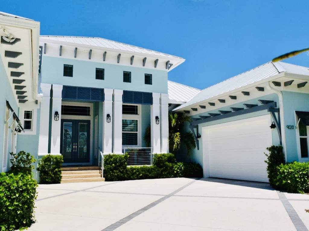 blue bahama shutters on a light blue house